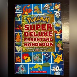 Scholastics POKÉMON SUPER DELUXE ESSENTIAL HANDBOOK !